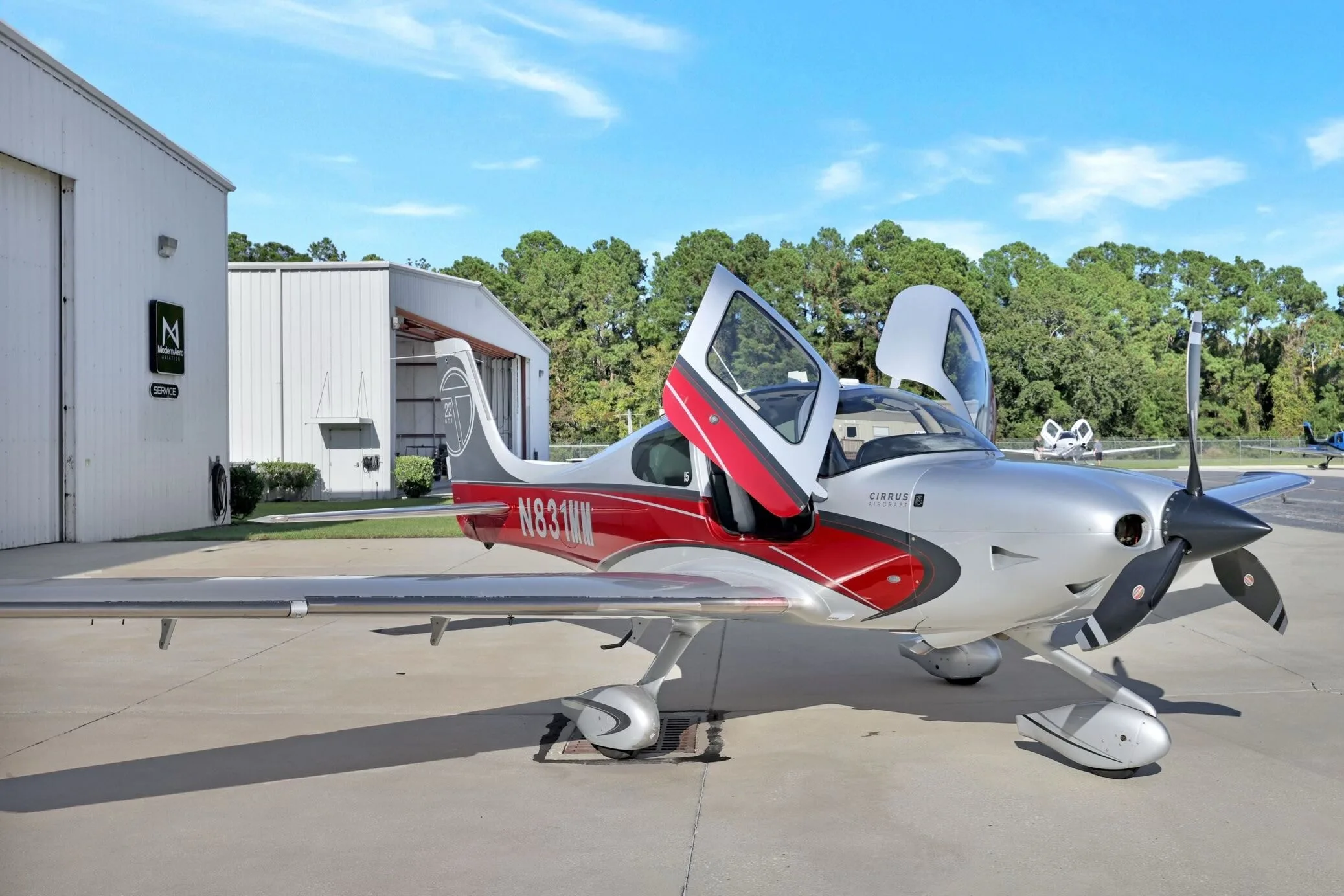 Exterior view of a 2013 Cirrus SR22T G5 GTS, N574TB.