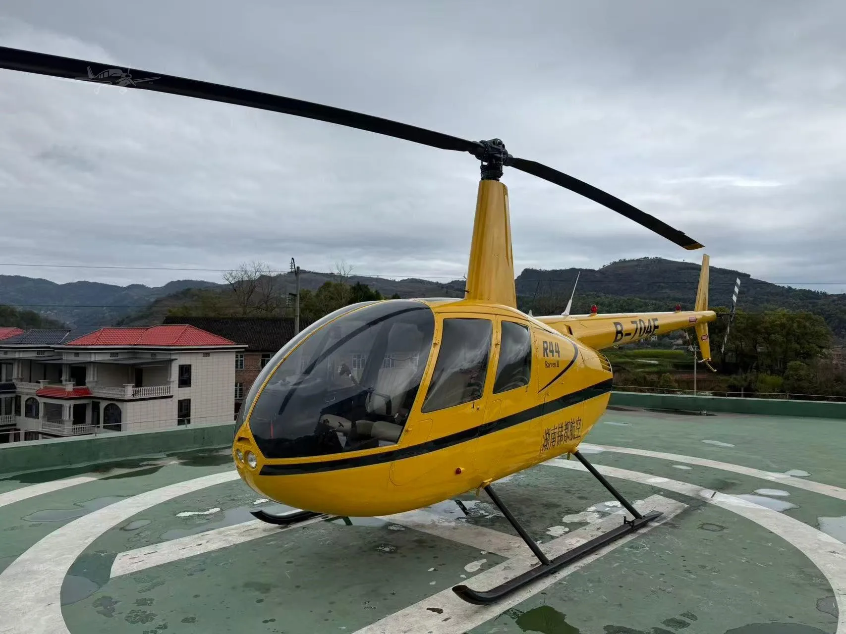 Exterior view of a 2003 ROBINSON R44 RAVEN II.