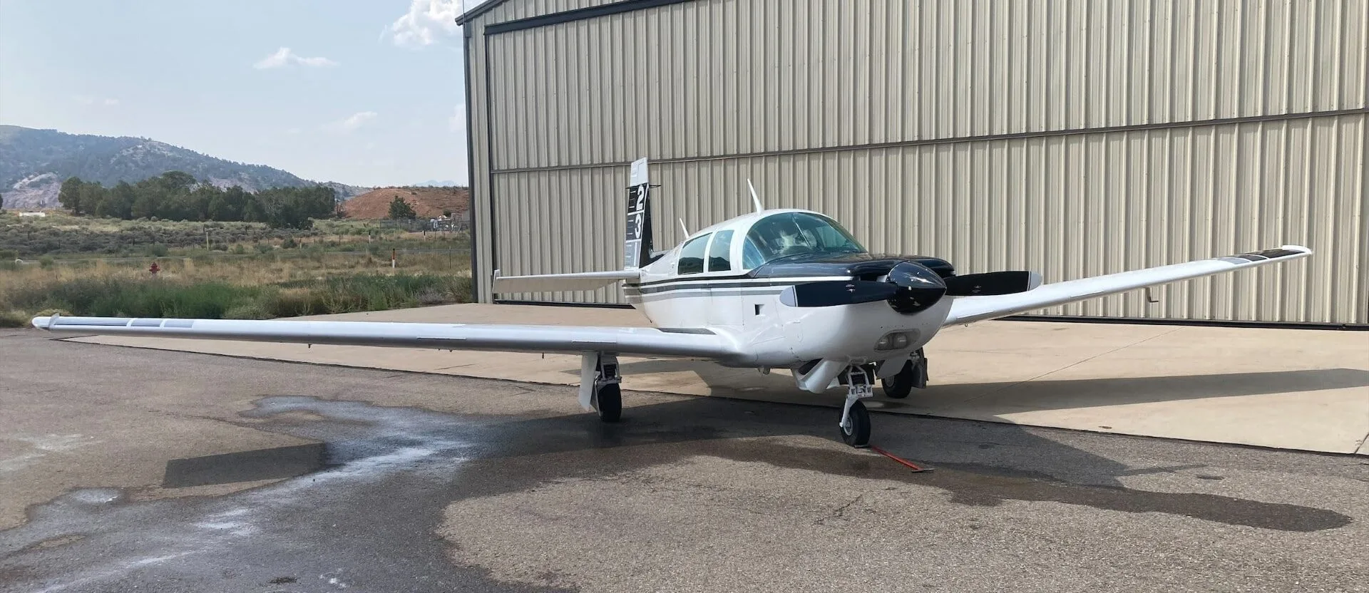 Exterior view of a 1996 Mooney M20J MSE, N2RH.