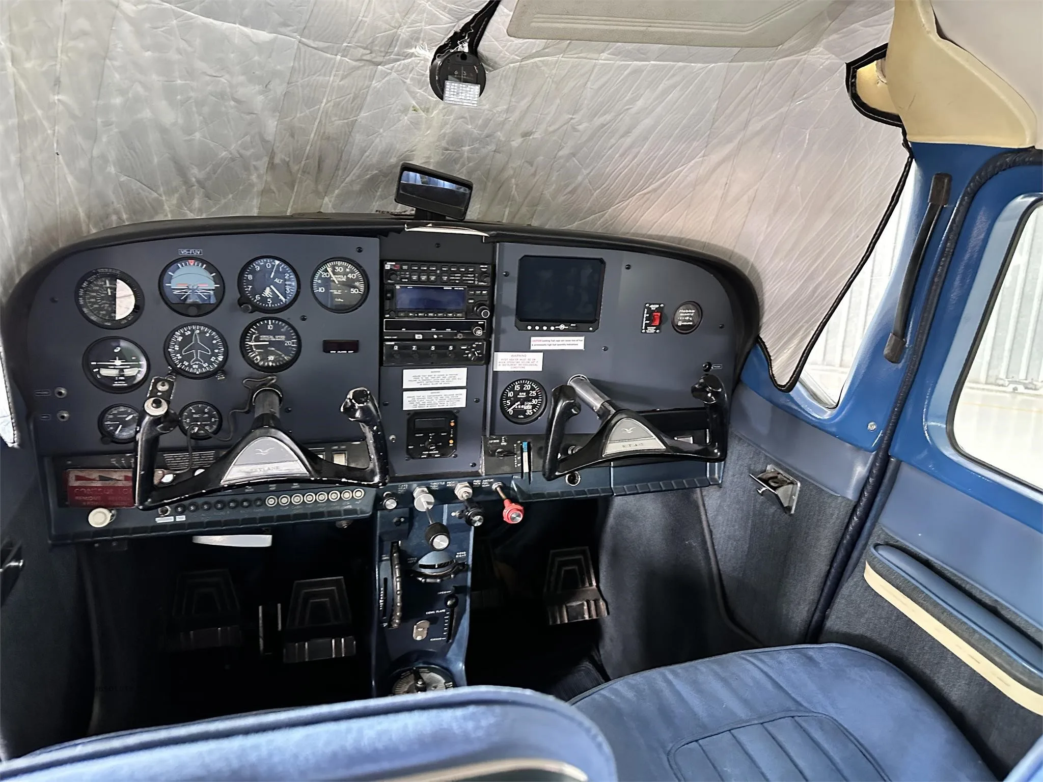 Cockpit and instrument panel of a 1969 CESSNA 182 SKYLANE.