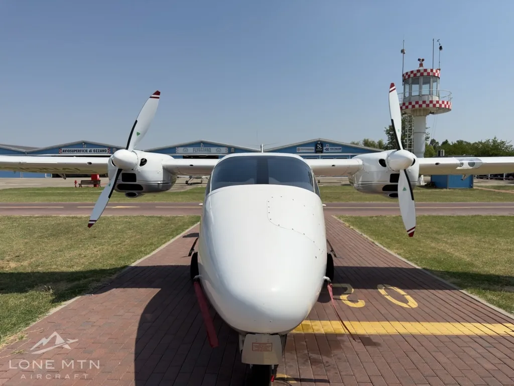 Exterior view of a 2021 Tecnam P2006T, I-OZZI.
