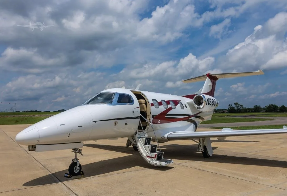 Exterior view of a 2009 EMBRAER PHENOM 100, N580JH.