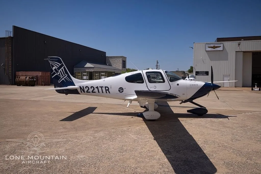 Exterior view of a 2021 CIRRUS SR20-G6, N221TR.