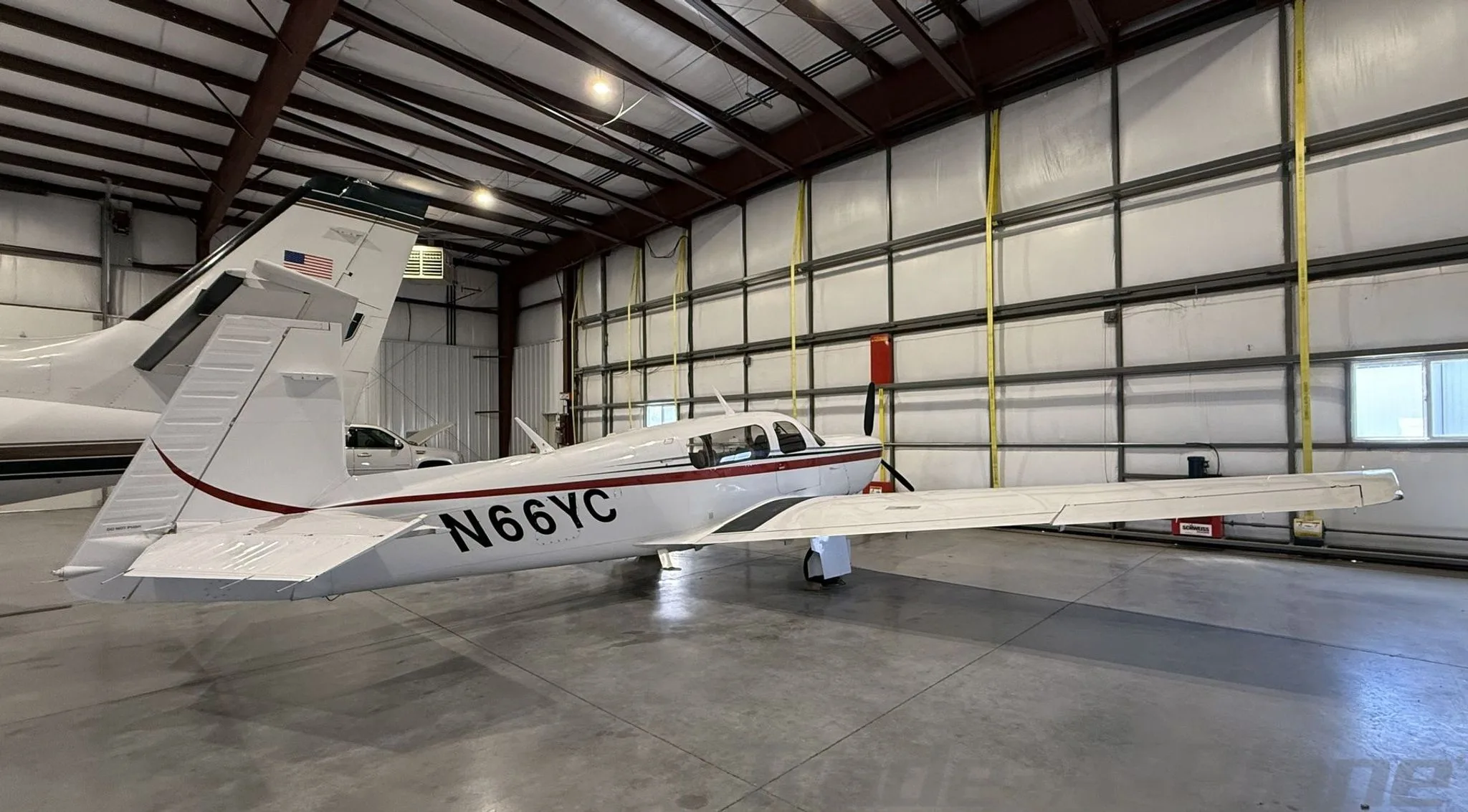 Exterior view of a 2005 MOONEY M20M GX BRAVO, N66YC.