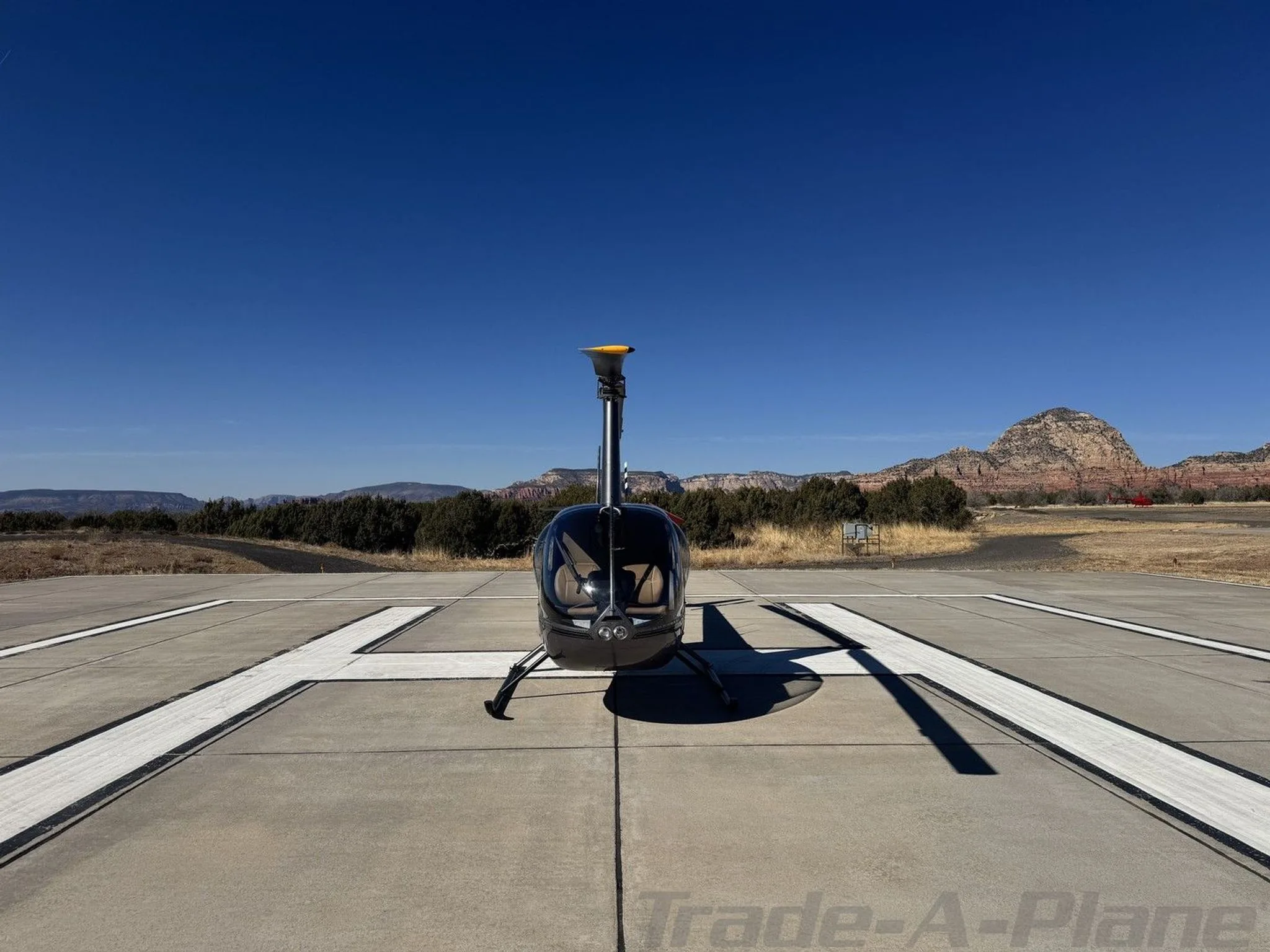 Exterior view of a 2002 ROBINSON R44 RAVEN II, N622.
