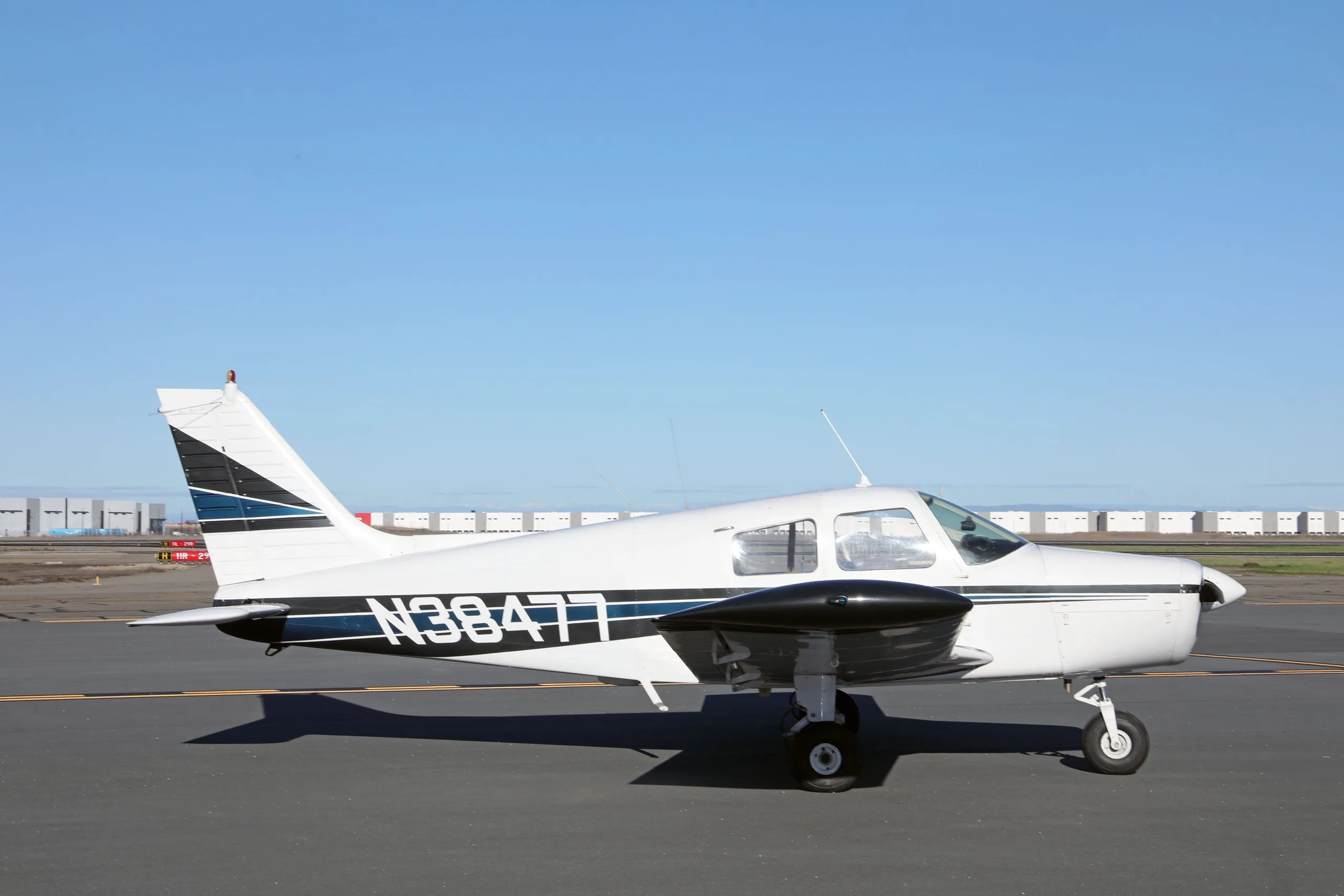 Exterior view of a 1977 Piper Cherokee 140, N38477.