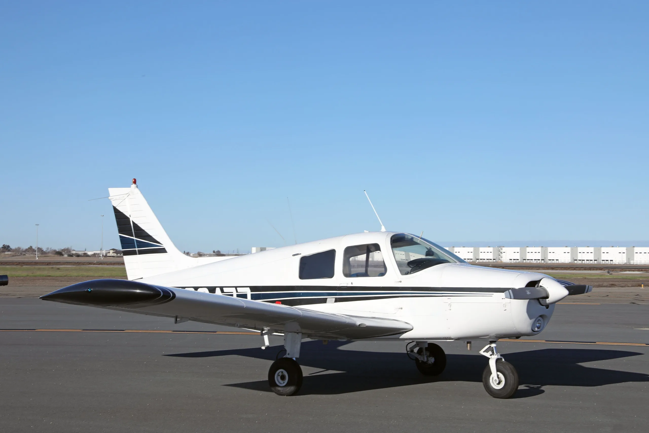 Exterior view of a 1977 Piper Cherokee 140, N38477.