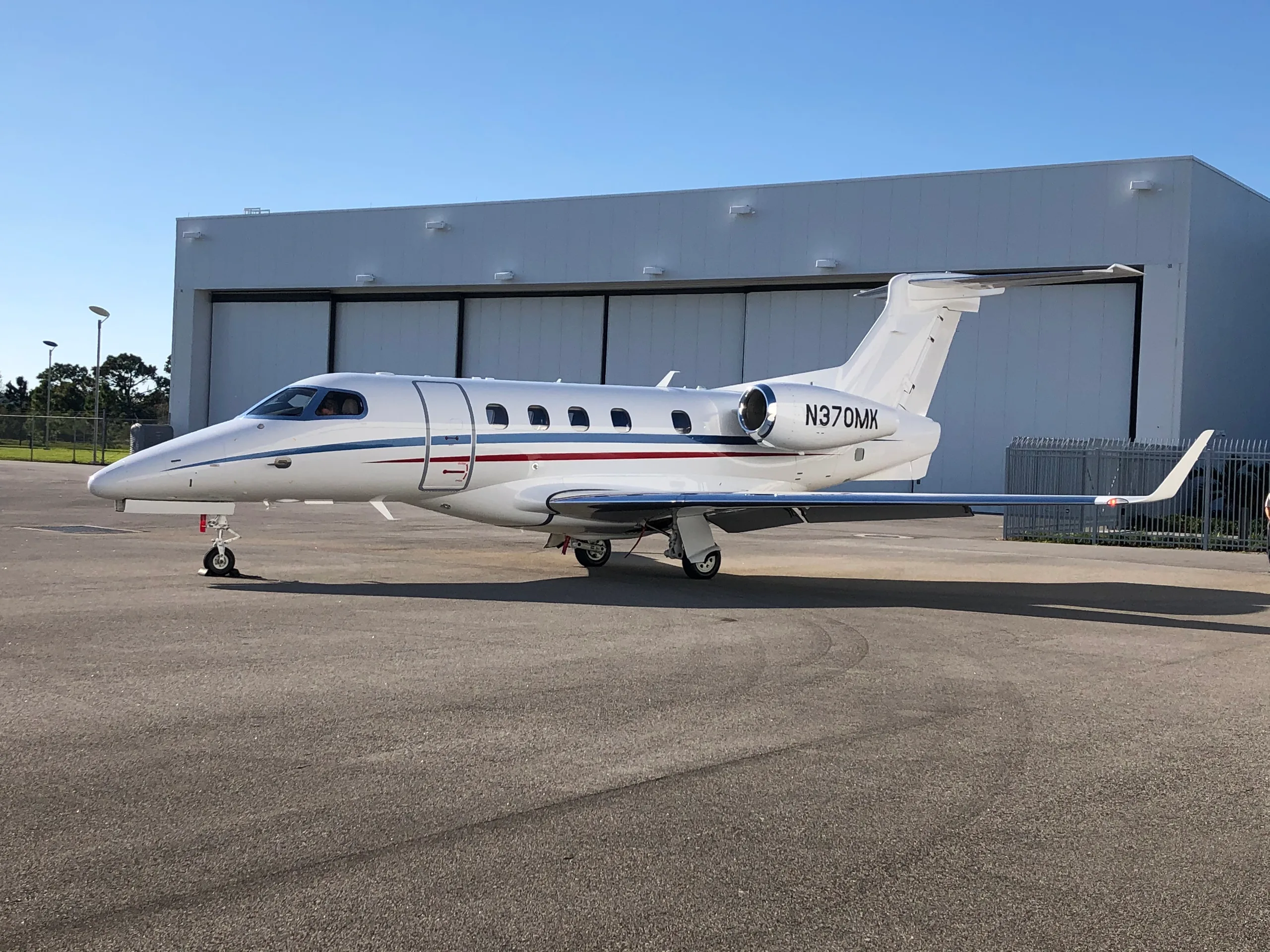 Exterior view of a 2019 Embraer Phenom 300E.