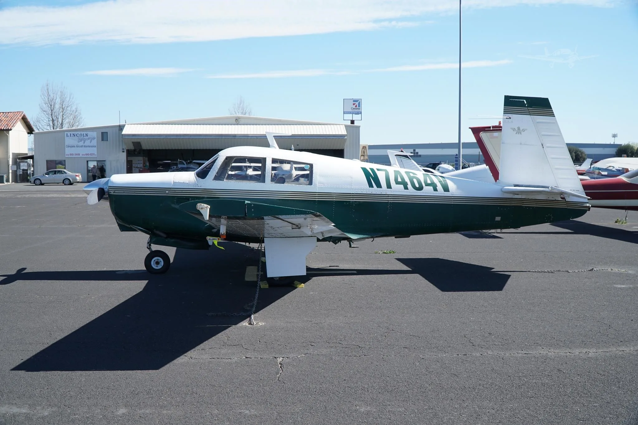 Exterior view of a 1975 MOONEY M20C, N7464V.