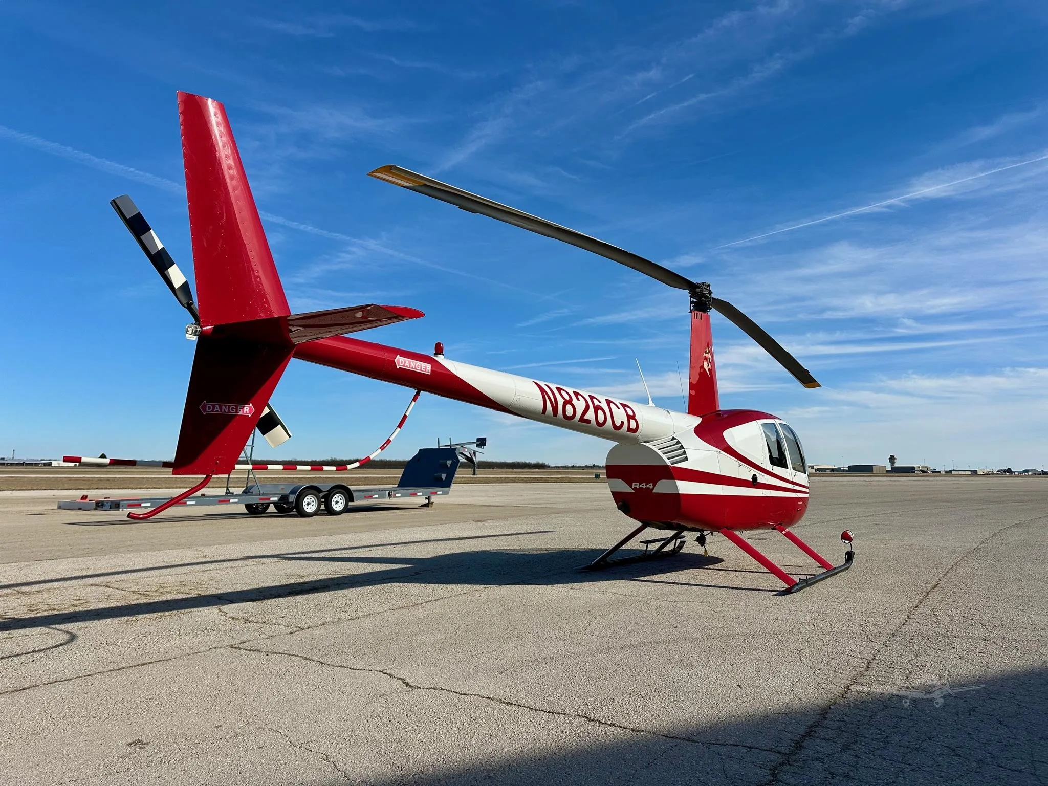 Exterior view of a 2006 ROBINSON R44 RAVEN II, N826CB.