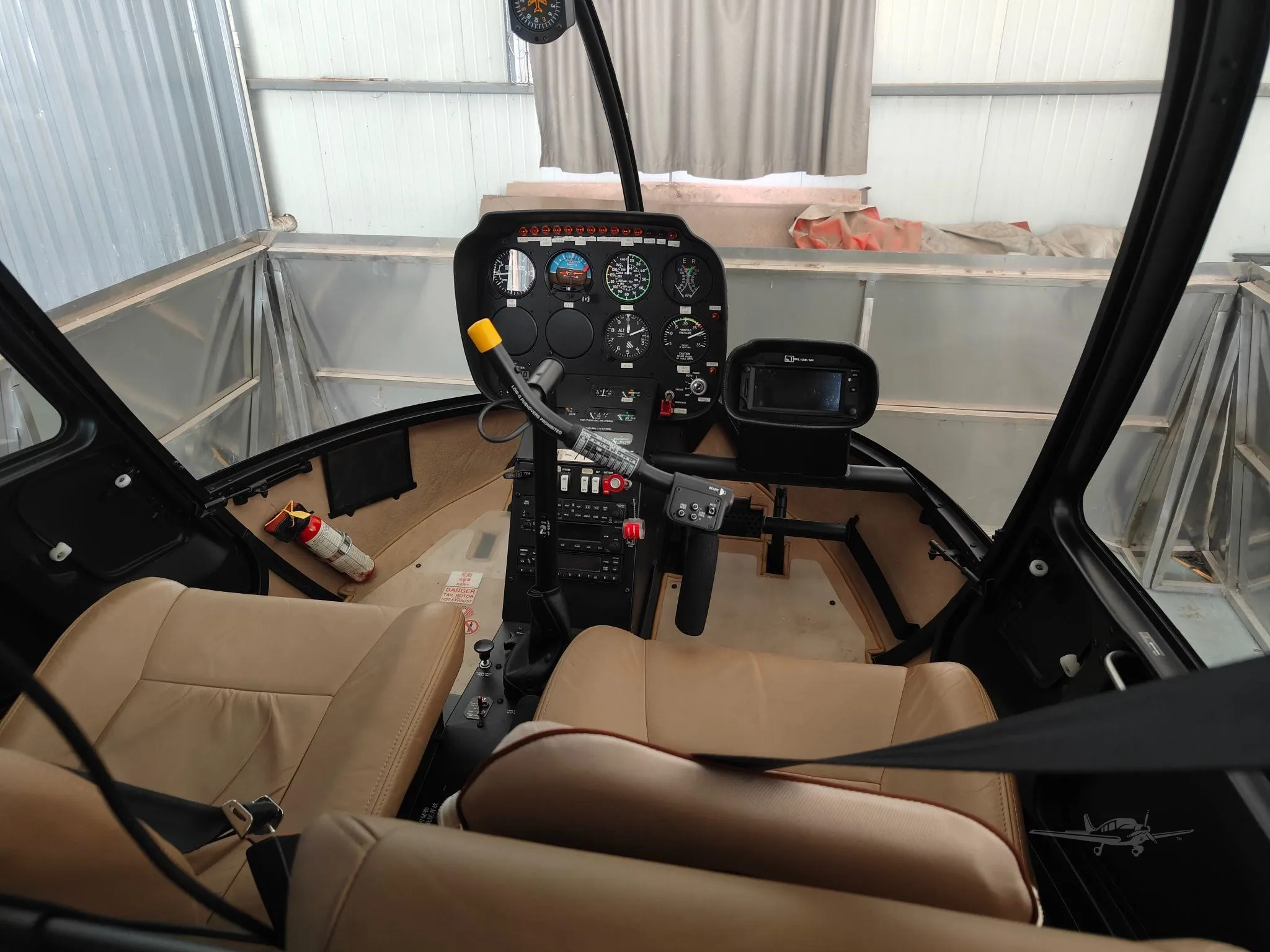 Cockpit and instrument panel of a 2018 ROBINSON R44 RAVEN II.