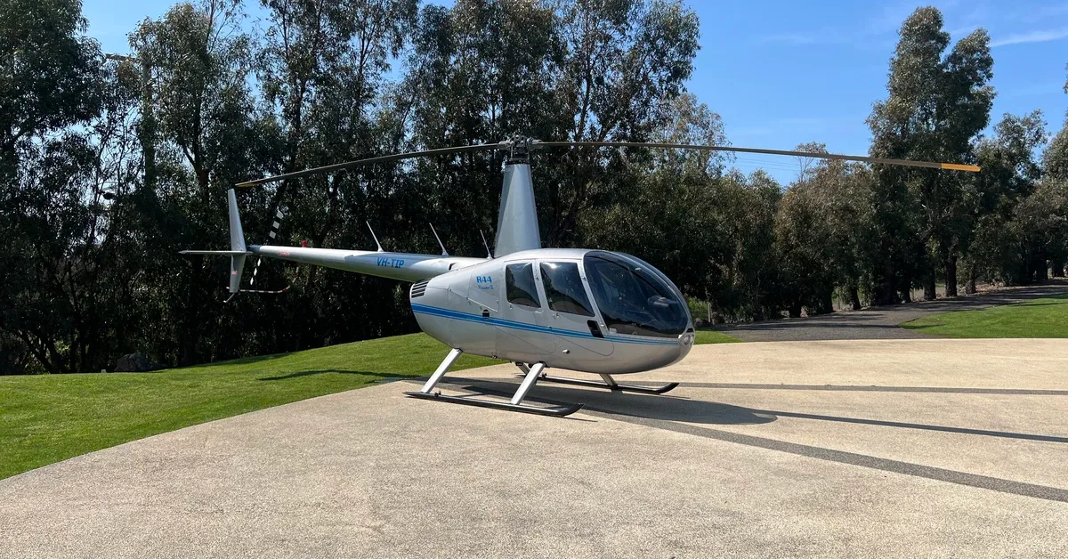 Exterior view of a 2007 Robinson R44 Raven II, VH-TIP.