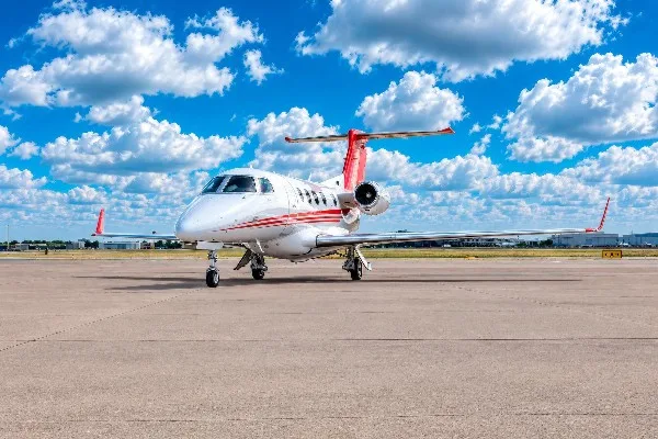 Exterior view of a 2020 Embraer Phenom 300, N43DJ.