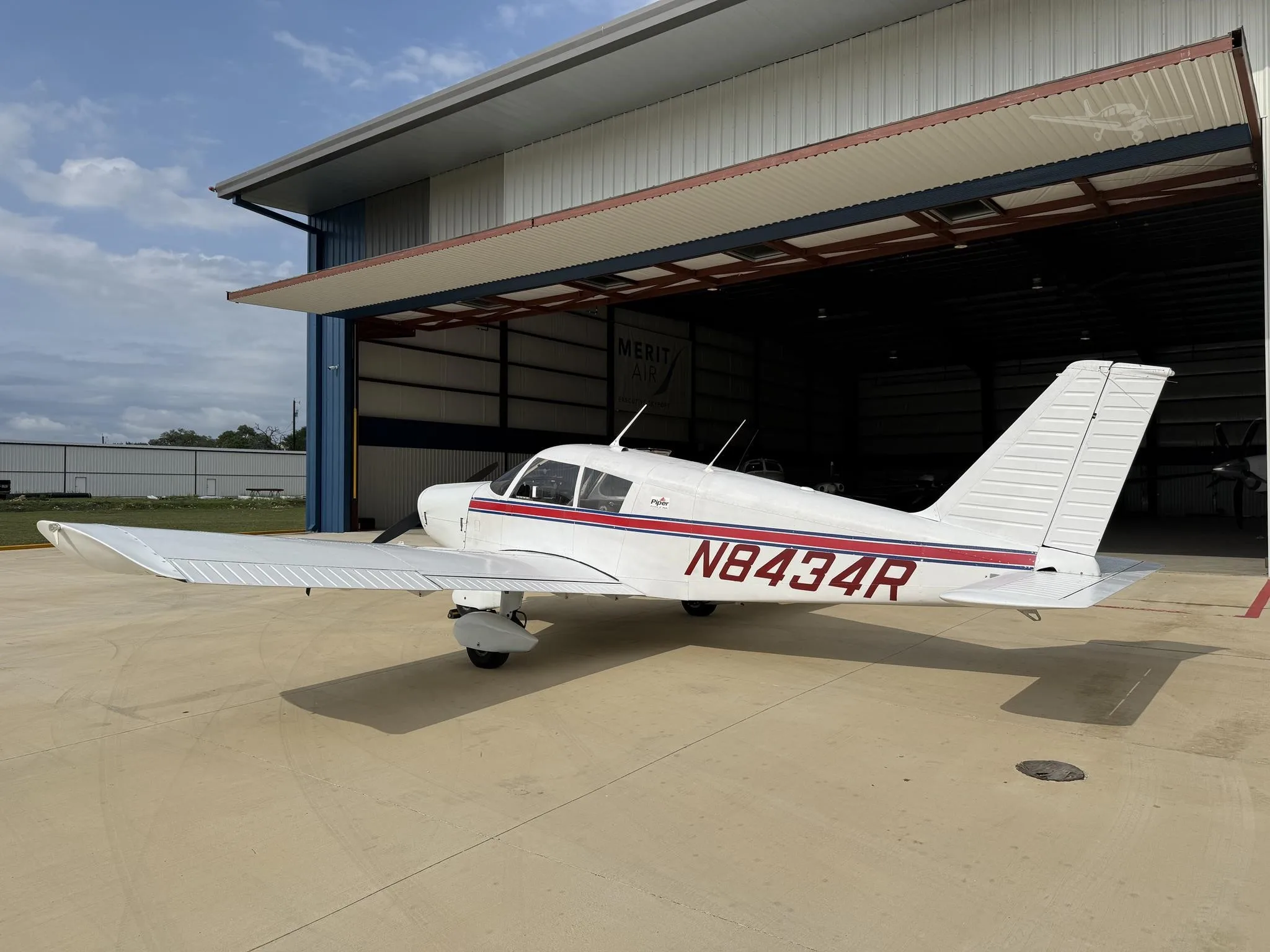Exterior view of a 1966 PIPER CHEROKEE 140, N8434R.