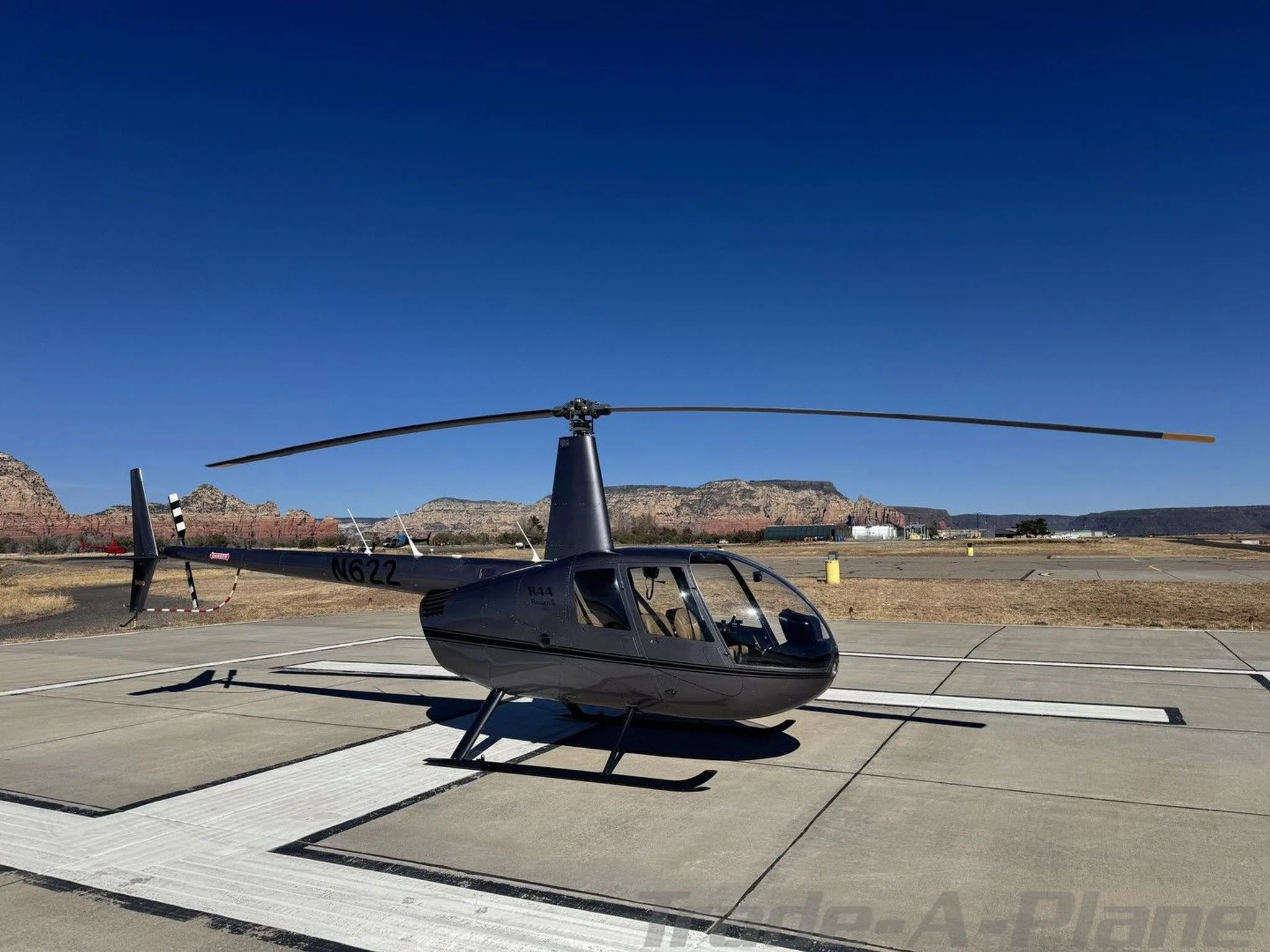 Exterior view of a 2002 ROBINSON R44 RAVEN II, N622.