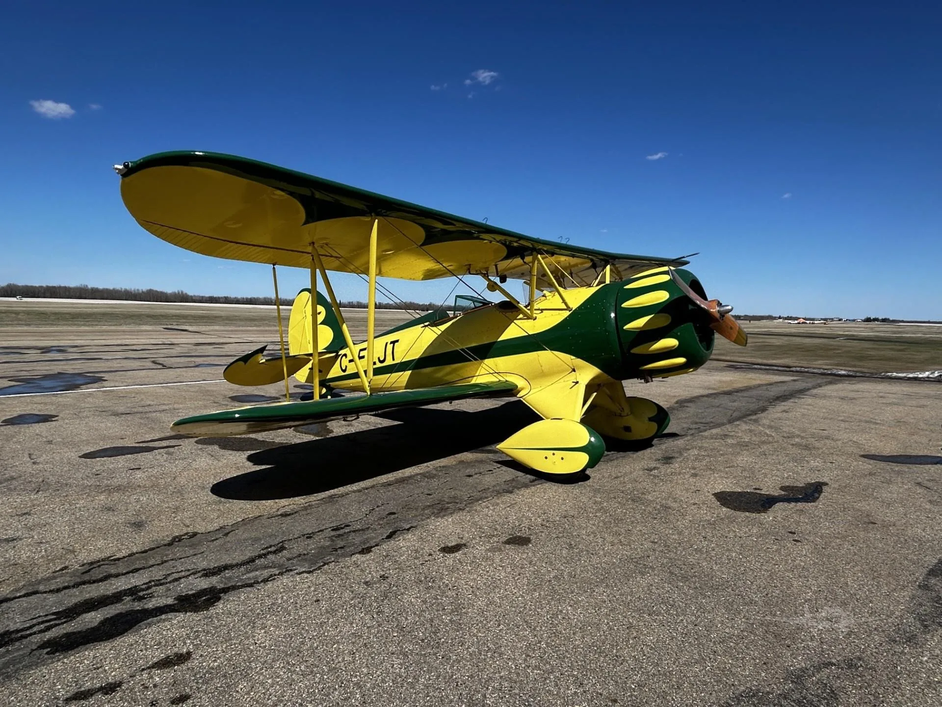 Exterior view of a 2000 WACO YMF-5C, C-FLJT.
