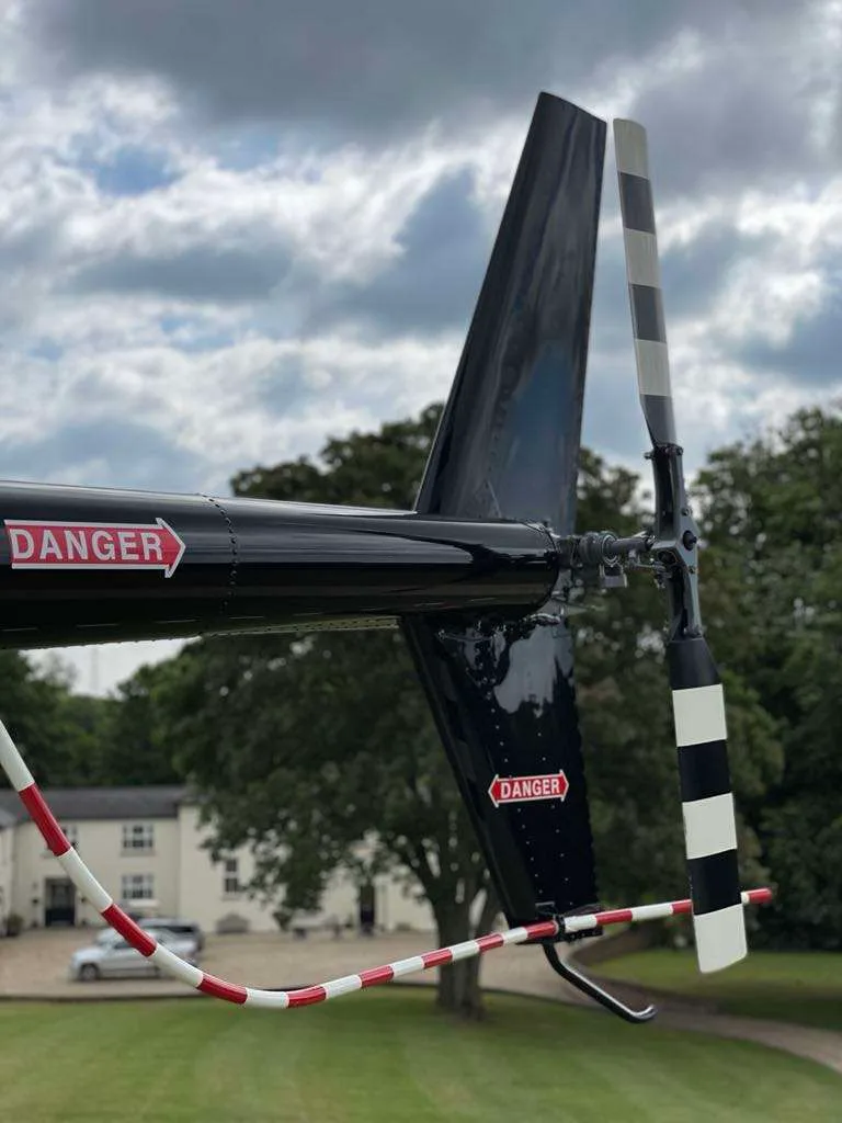 Exterior view of a 2002 Robinson R44 Raven II.