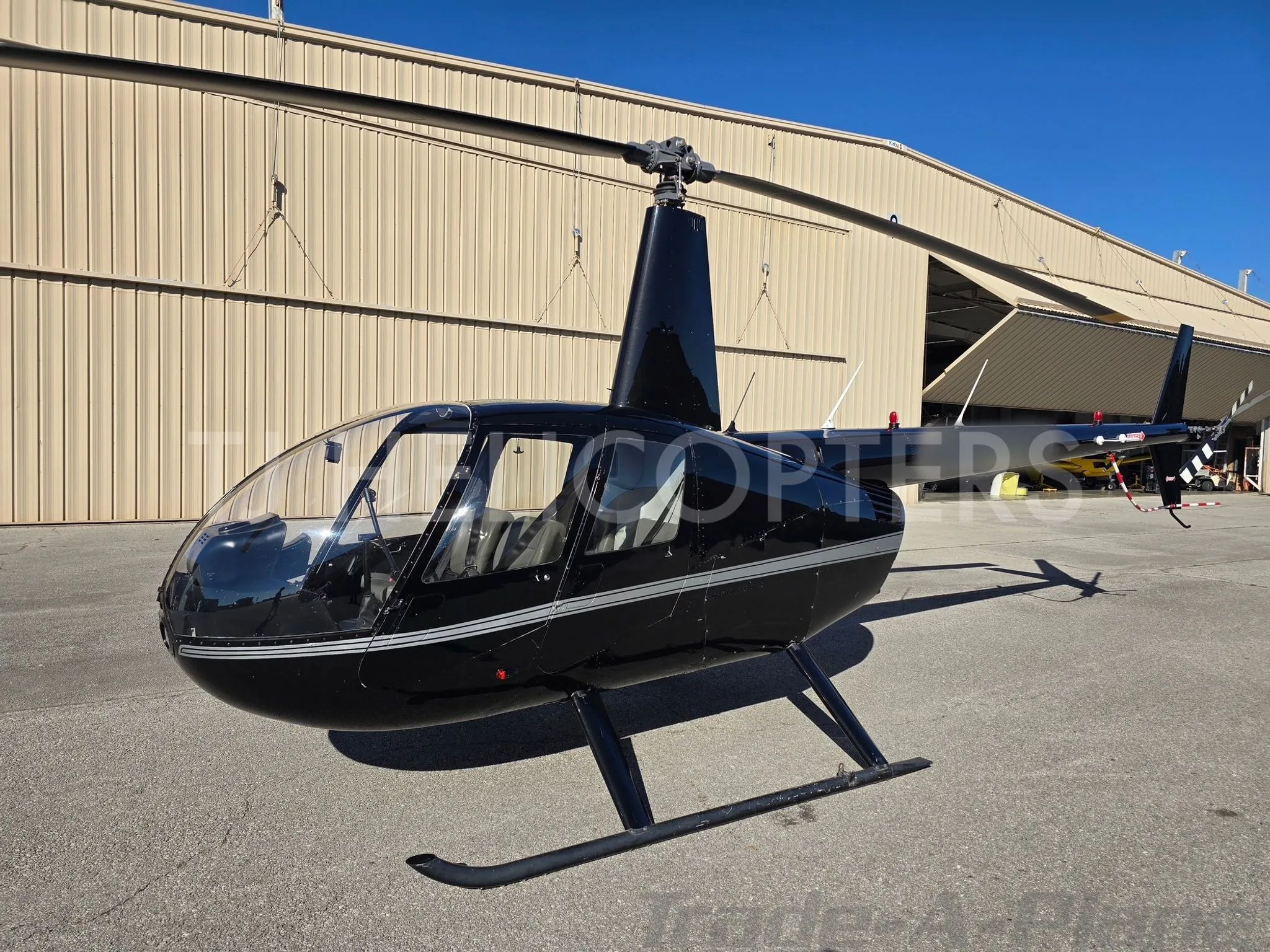 Exterior view of a 2007 ROBINSON R44 RAVEN II.