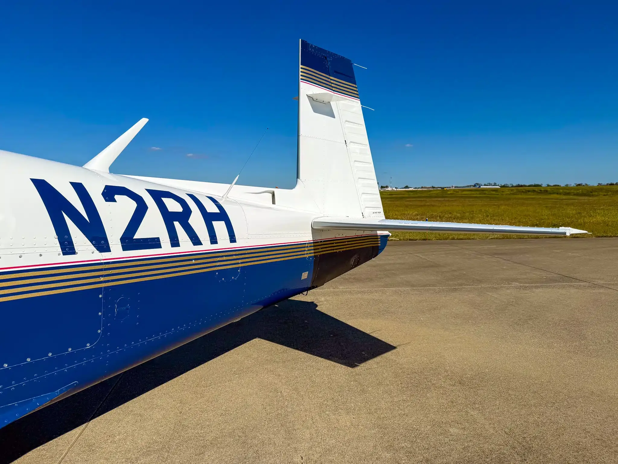 Exterior view of a 1996 Mooney M20J MSE, N2RH.