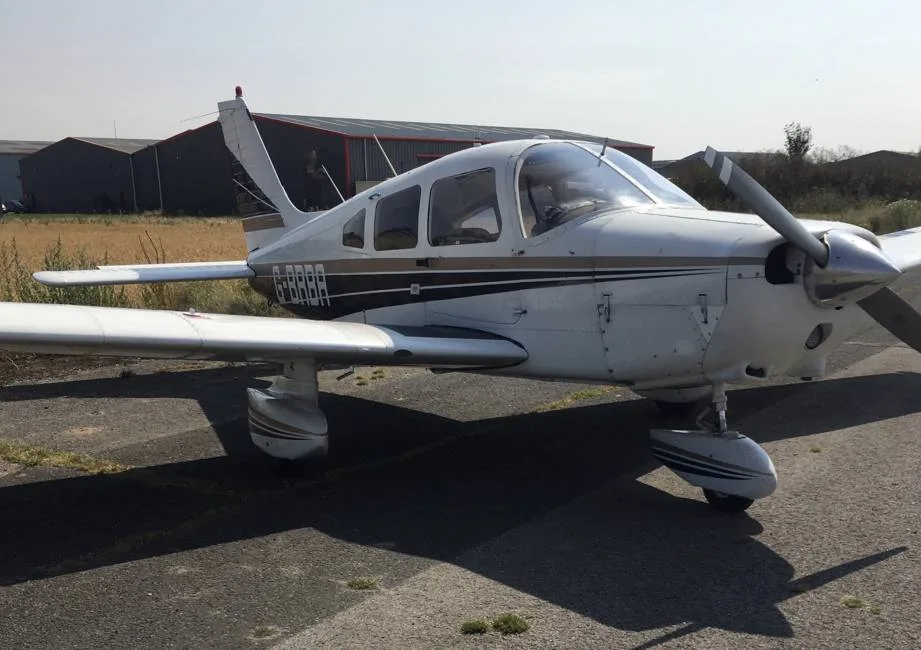Exterior view of a 1984 Piper PA28-181 Archer II.