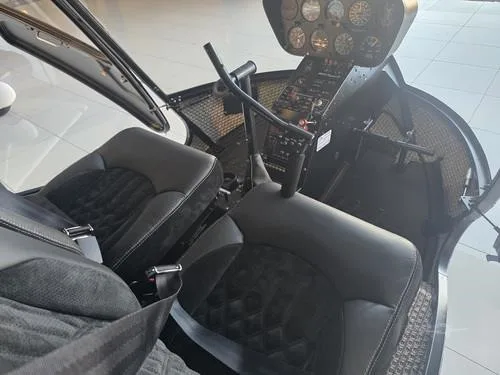 Cockpit and instrument panel of a 2007 ROBINSON R44 RAVEN II.