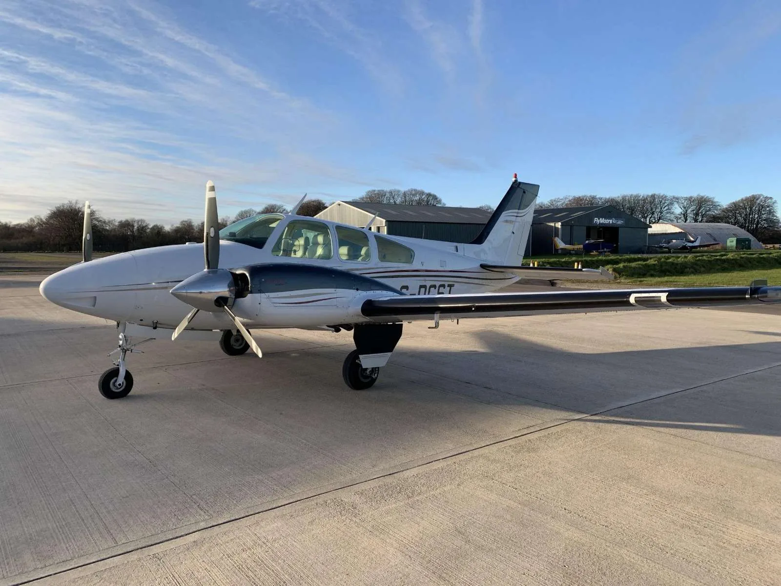 Exterior view of a 1976 Beechcraft Baron B55, G-DGST.