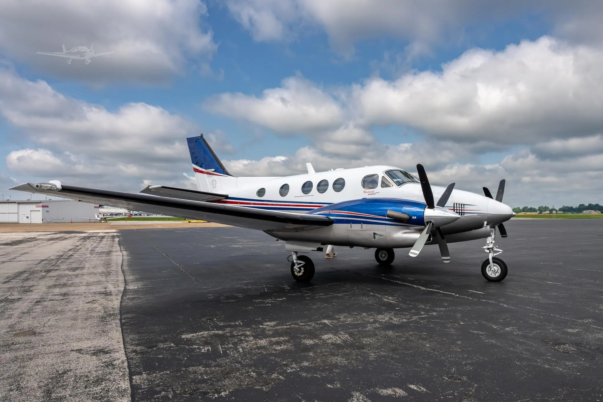 Exterior view of a 2009 BEECHCRAFT KING AIR C90GTI, N6211J.