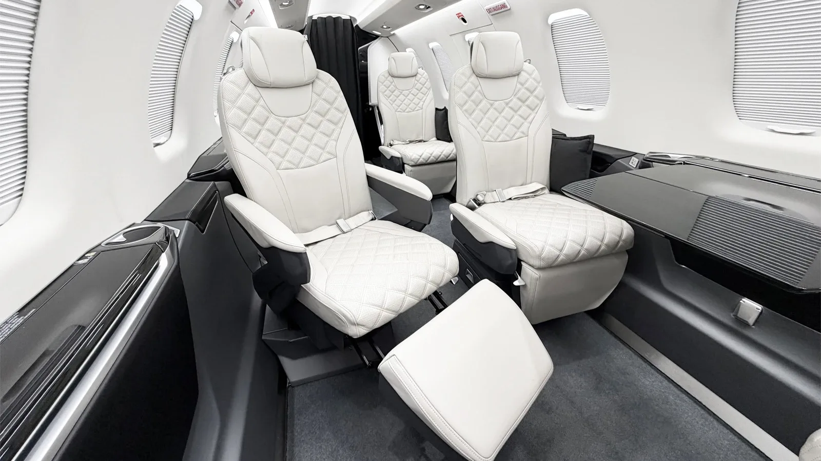Cabin interior of a Pilatus Jet.