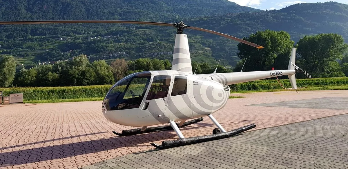 Exterior view of a 2003 Robinson R44 Clipper II, OM-HAB.