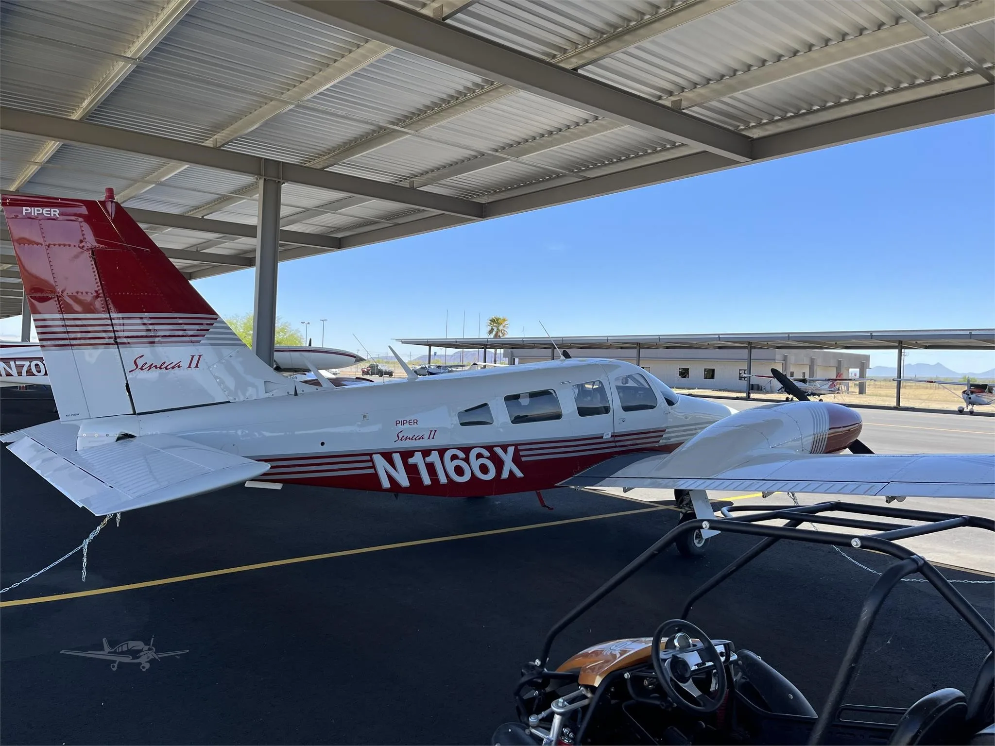 Exterior view of a 1975 PIPER SENECA II, N1166X.