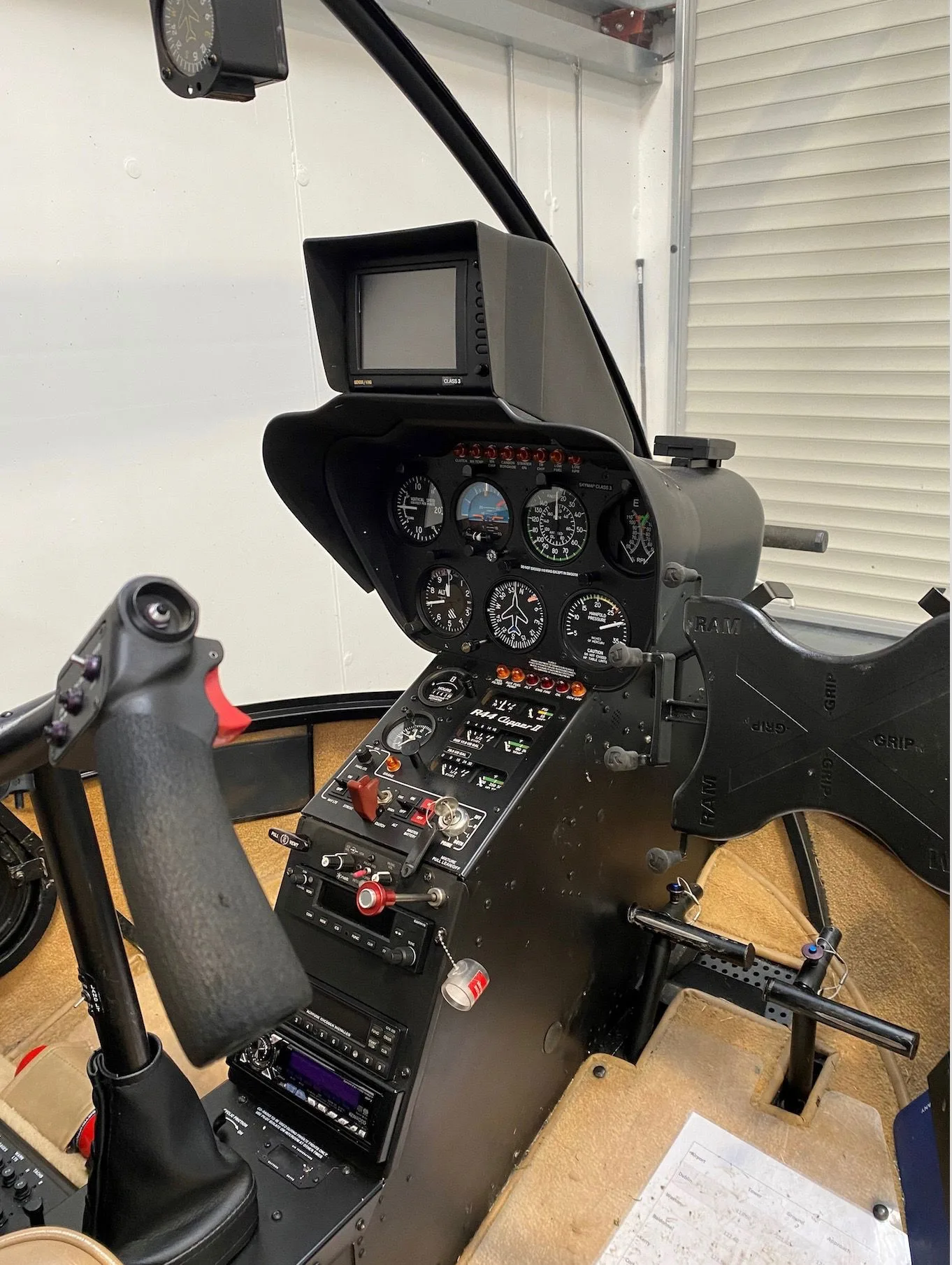 Cockpit and instrument panel of a 2005 Robinson R44 Clipper II.