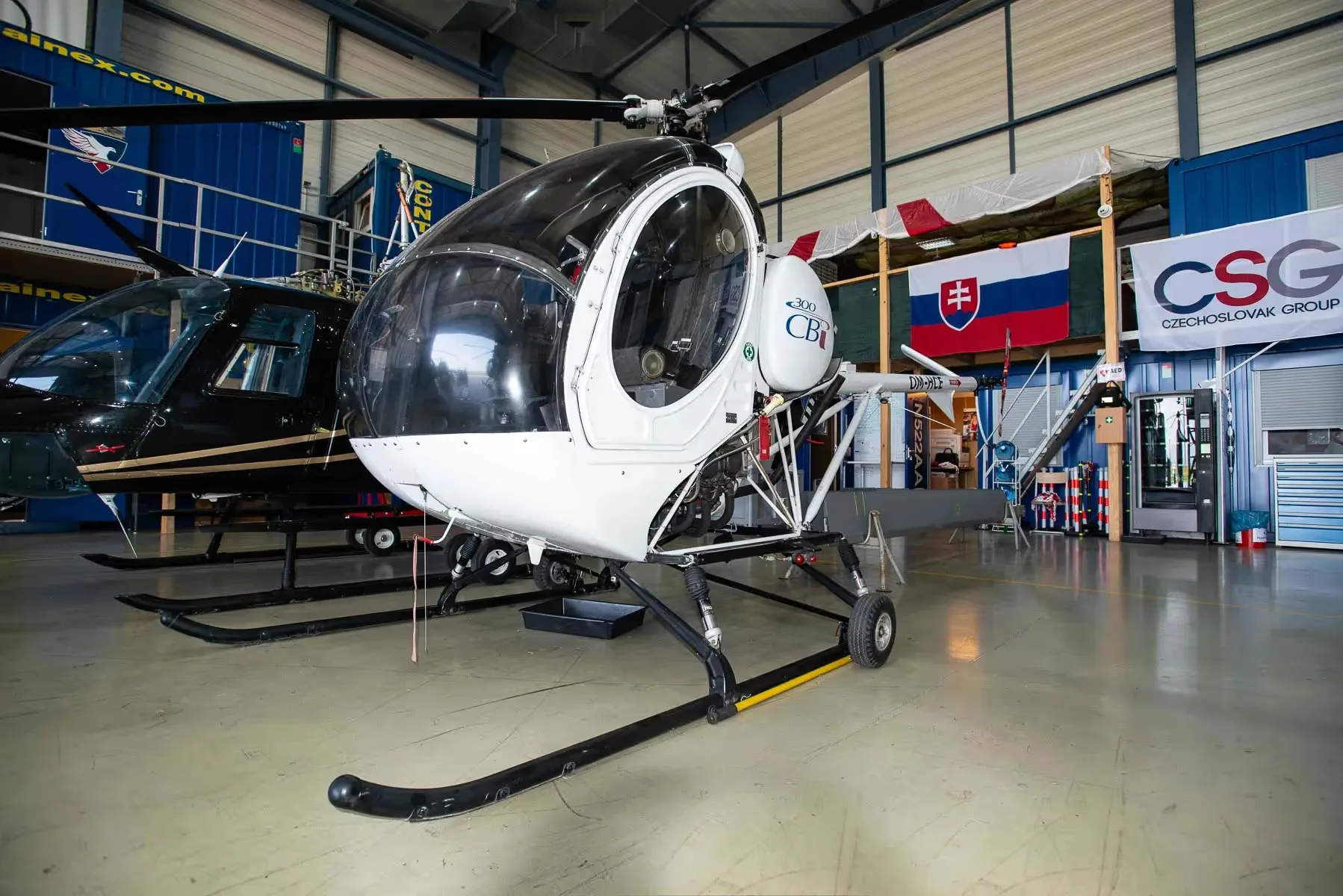 Exterior view of a 2007 Schweizer 269C-1, OM-HCE.