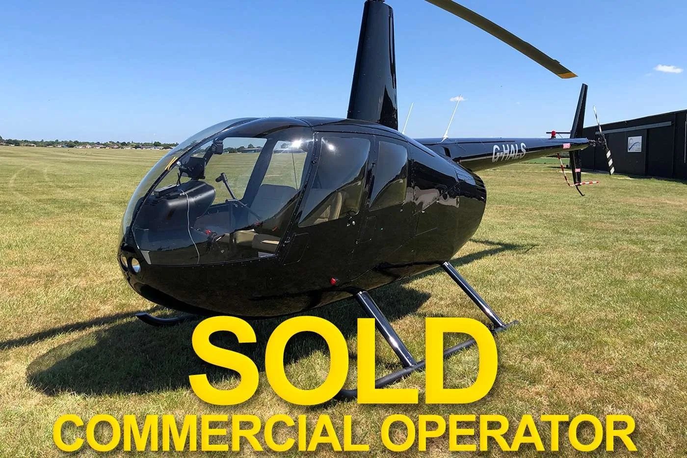 Exterior view of a 2006 Schweizer 269 CBi.