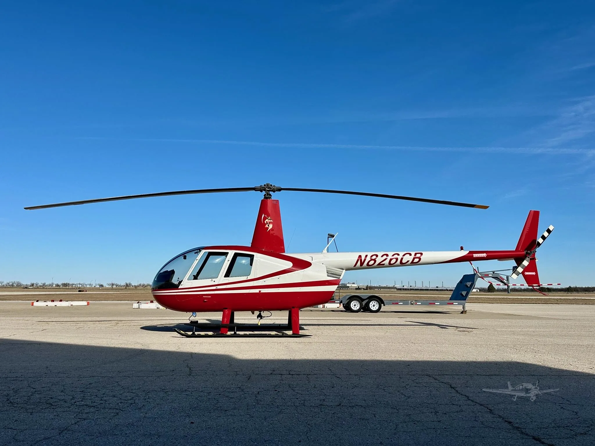Exterior view of a 2006 ROBINSON R44 RAVEN II, N826CB.