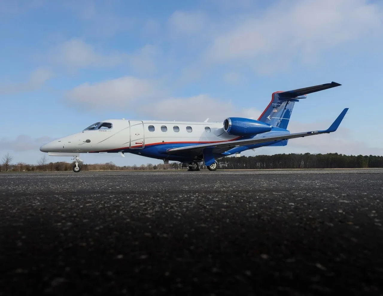 Exterior view of a 2022 Embraer Phenom 300E.