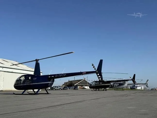 Exterior view of a 2010 ROBINSON R44 RAVEN I, G-TPTP.