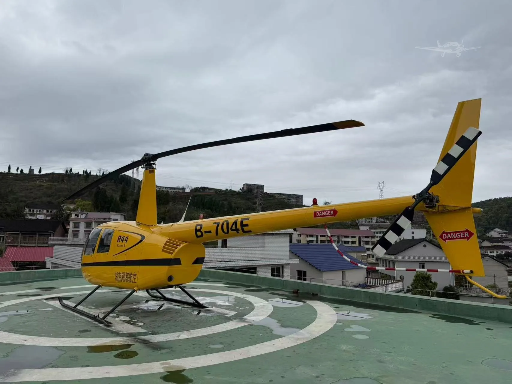 Exterior view of a 2003 ROBINSON R44 RAVEN II.