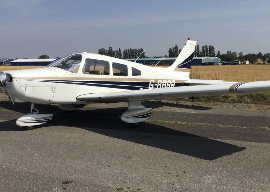 Exterior view of a 1984 Piper PA28-181 Archer II.