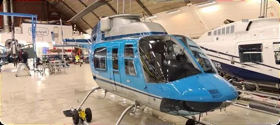 Exterior view of a 1987 BELL 206L-3, SE-JJU.