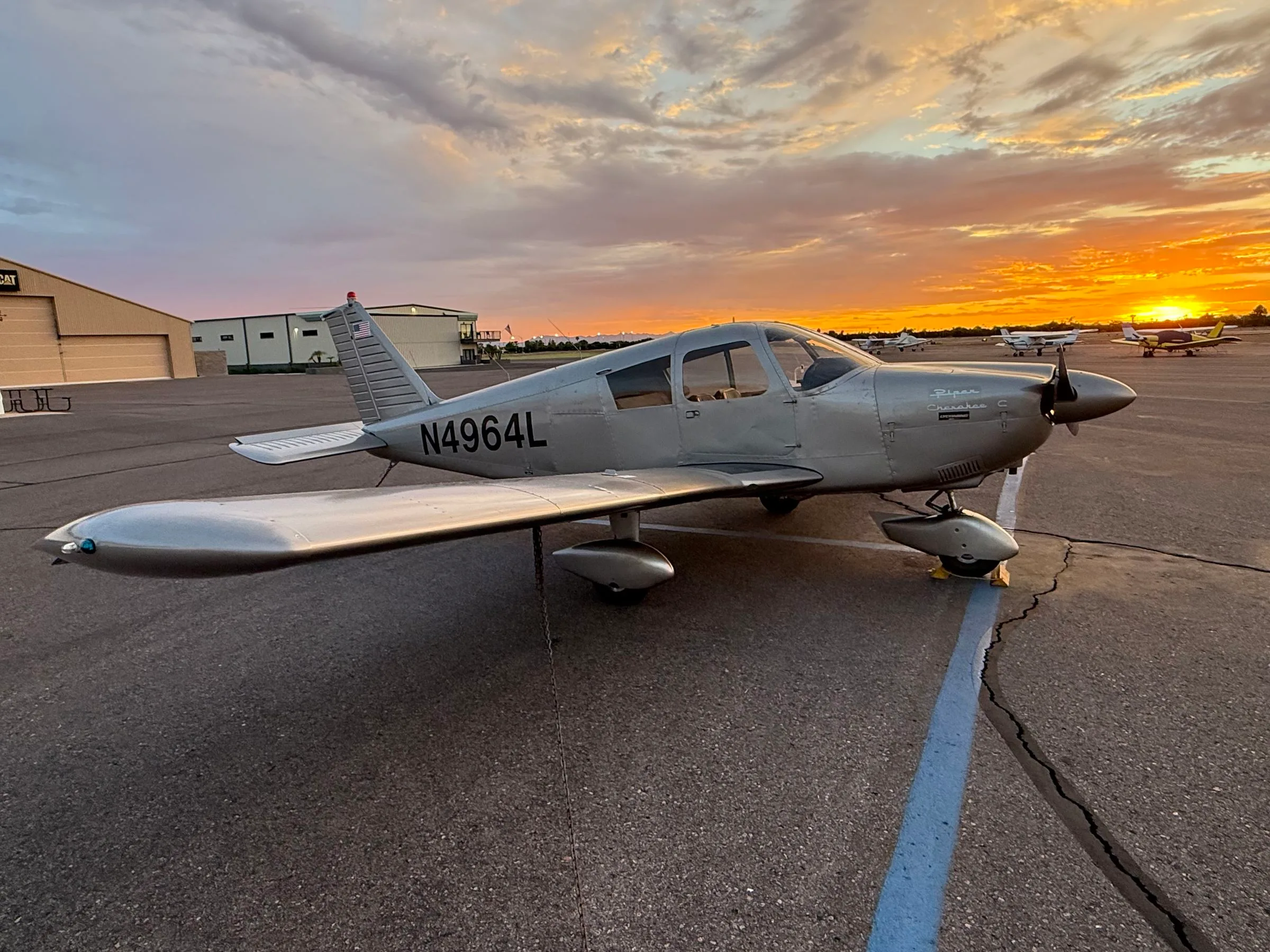 Exterior view of a 1967 Piper PA-28-180 Cherokee, N4964L.