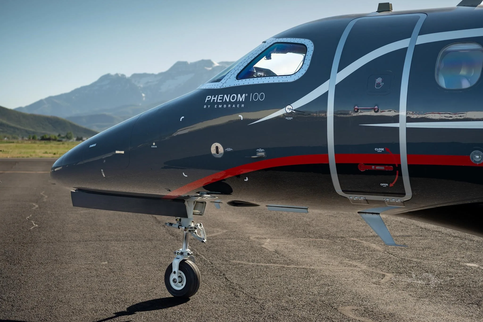 Marketing image of a 2013 EMBRAER PHENOM 100.