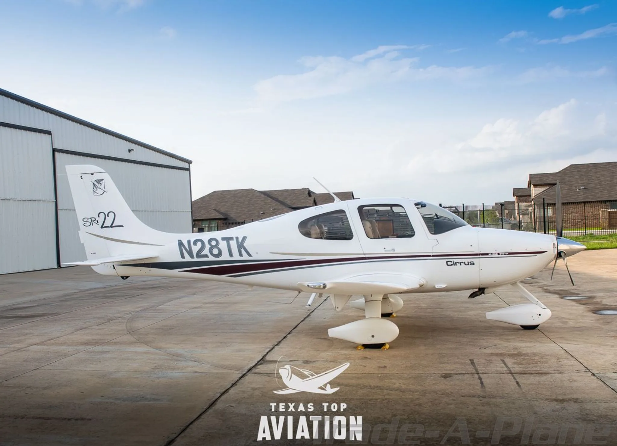 Exterior view of a 2002 CIRRUS SR22, N28TK.
