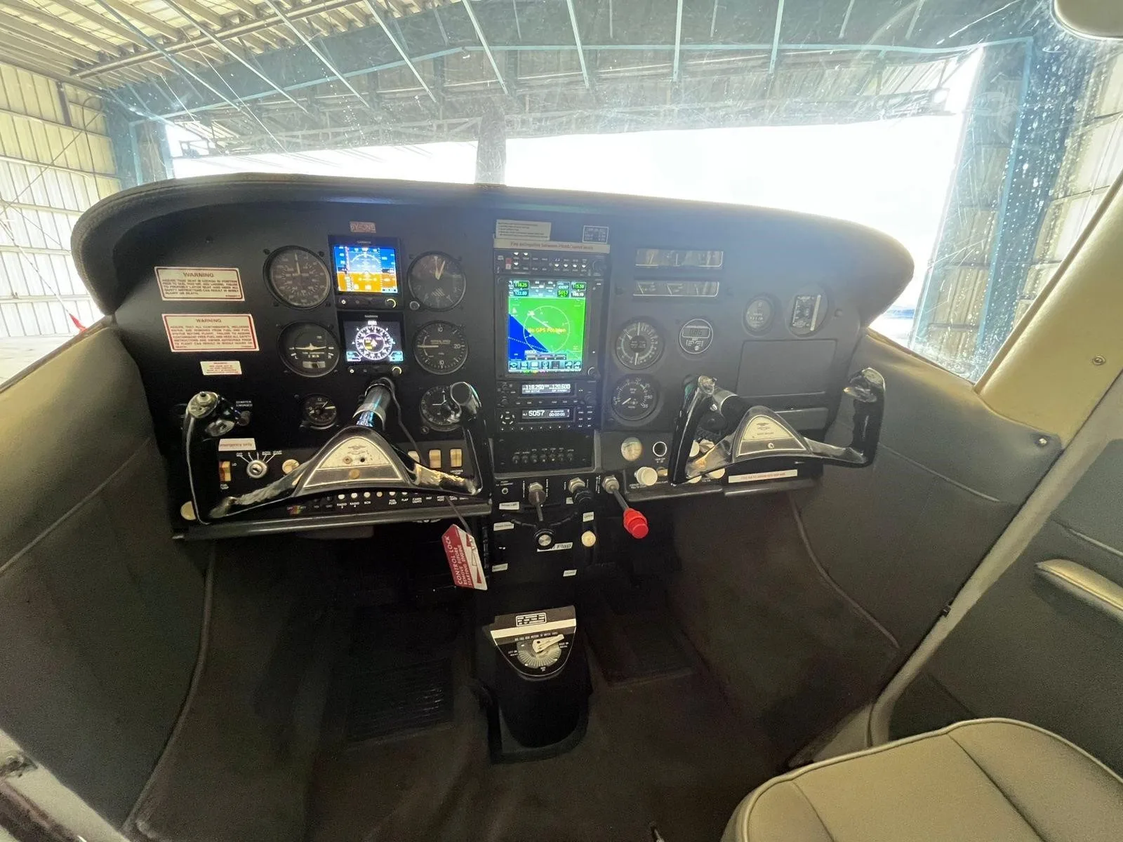 Cockpit and instrument panel of a 1967 CESSNA P206 SUPER SKYLANE.
