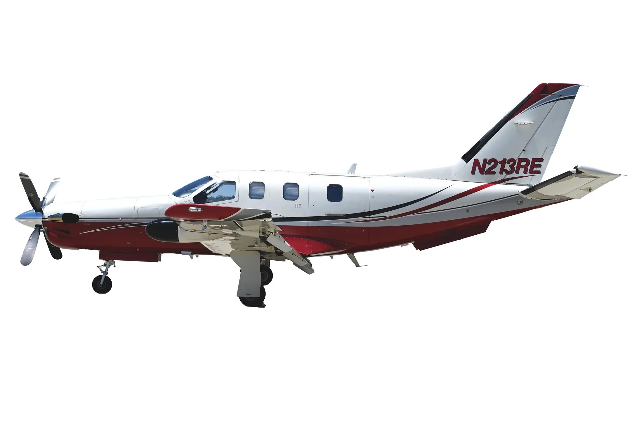 Exterior view of a 2002 DAHER TBM 700B, N213RE.