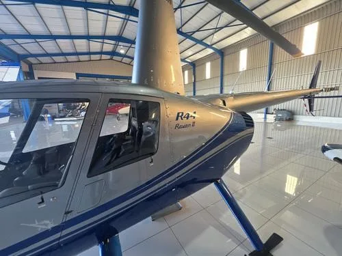Exterior view of a 2007 ROBINSON R44 RAVEN II, N611TH.