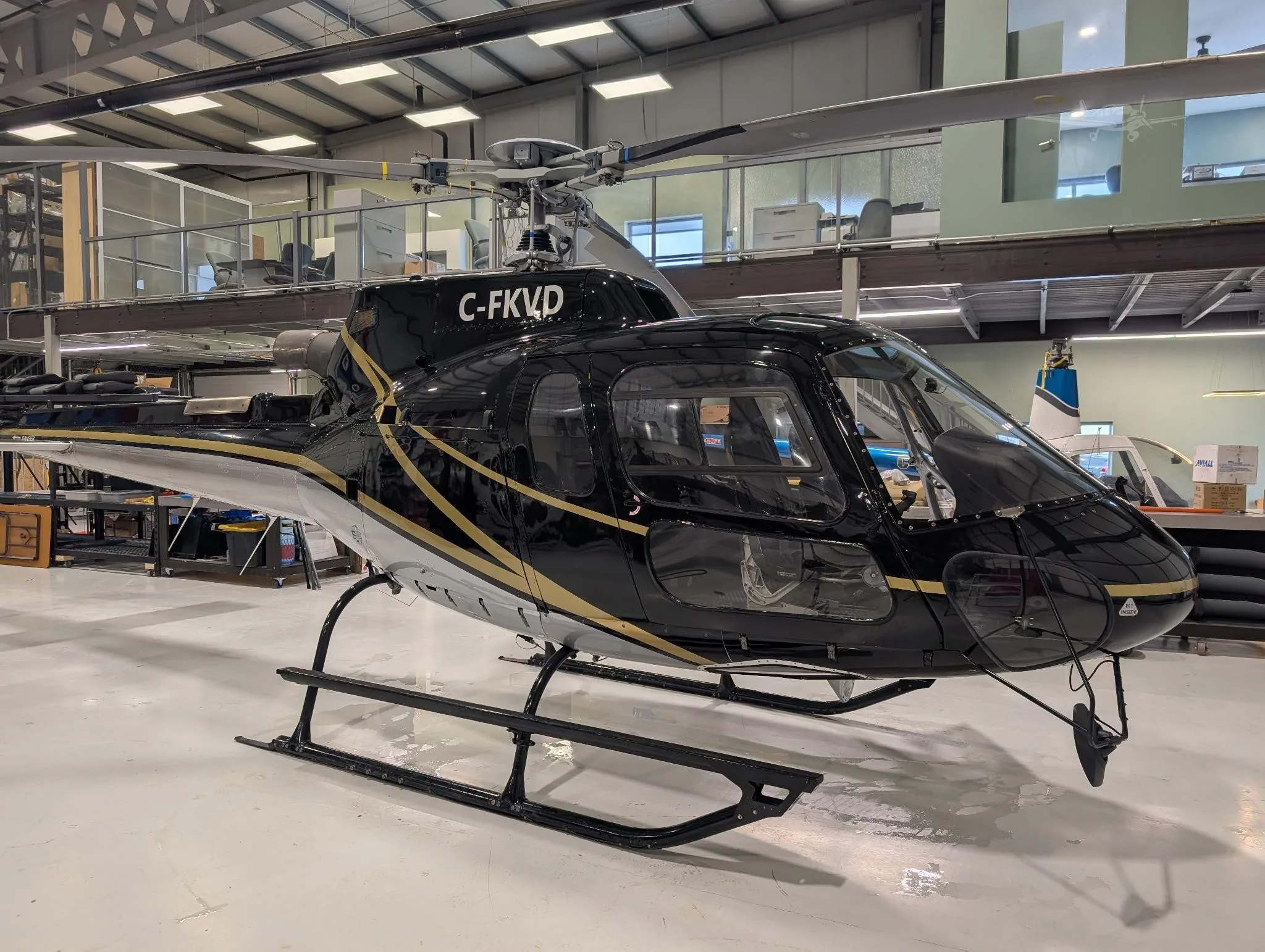 Exterior view of a 2003 EUROCOPTER AS350B-3, C-FKVD.
