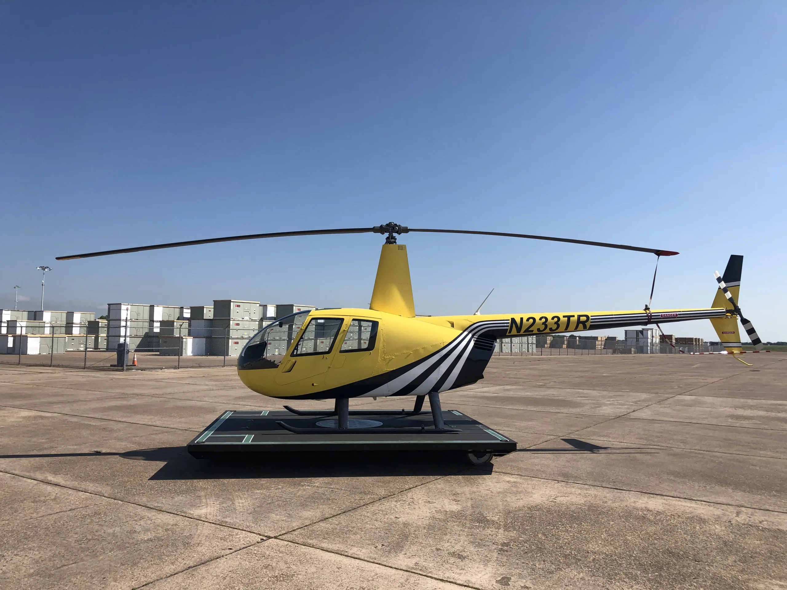 Exterior view of a 2003 Robinson R44 II, N233TR.