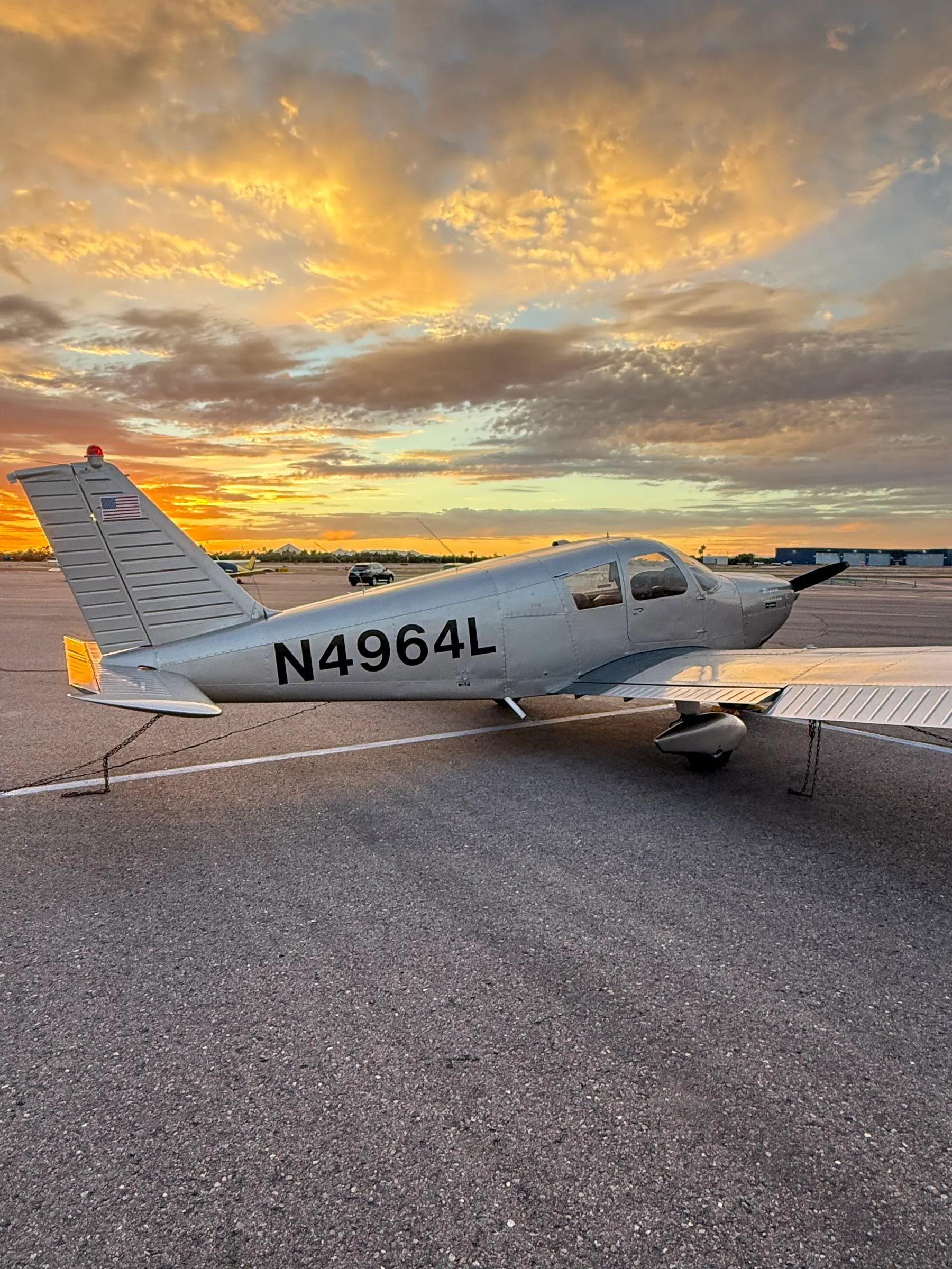 Exterior view of a 1967 Piper PA-28-180 Cherokee, N4964L.
