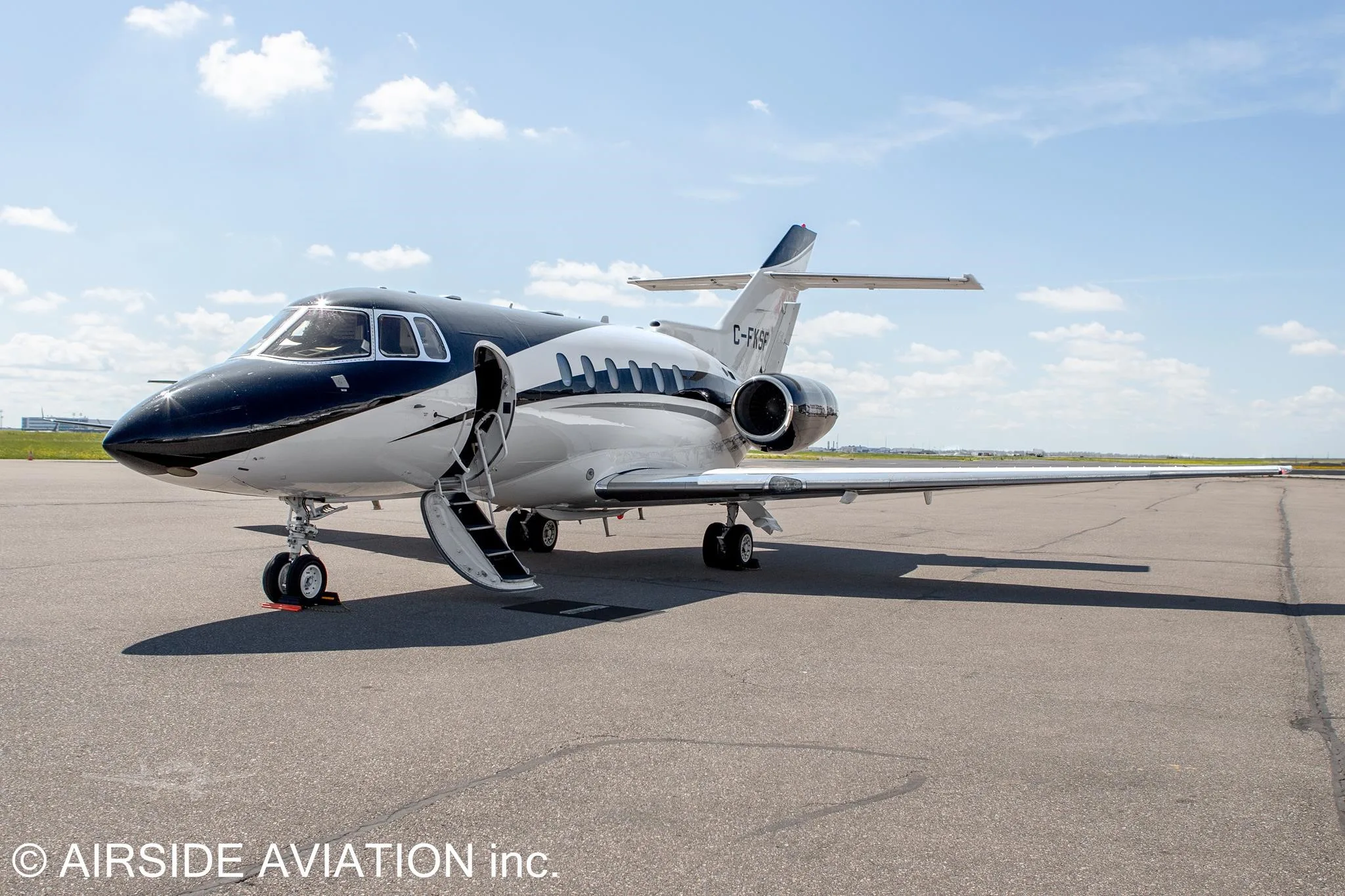 Exterior view of a 2003 HAWKER 800XP, C-FKSF.