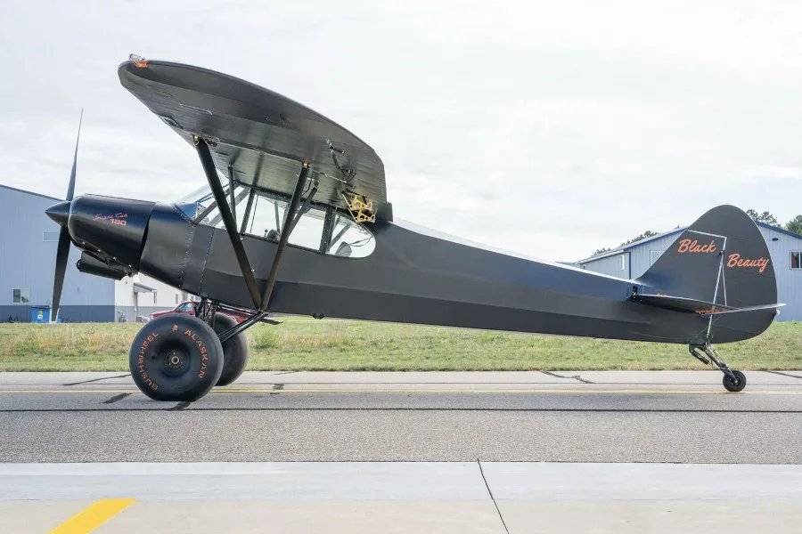 Marketing image of a 1957 Piper Super Cub PA-18-150.